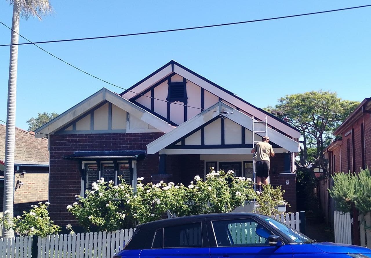Painting fascia boards on a heritage home
